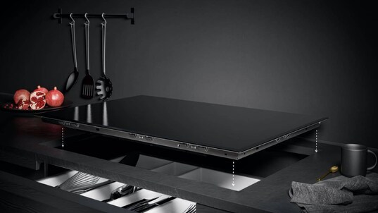 An induction hob placed in the kitchen.