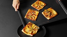 Pizza slices on a baking tray