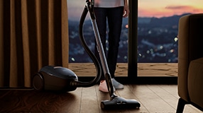 Person vacuuming living room